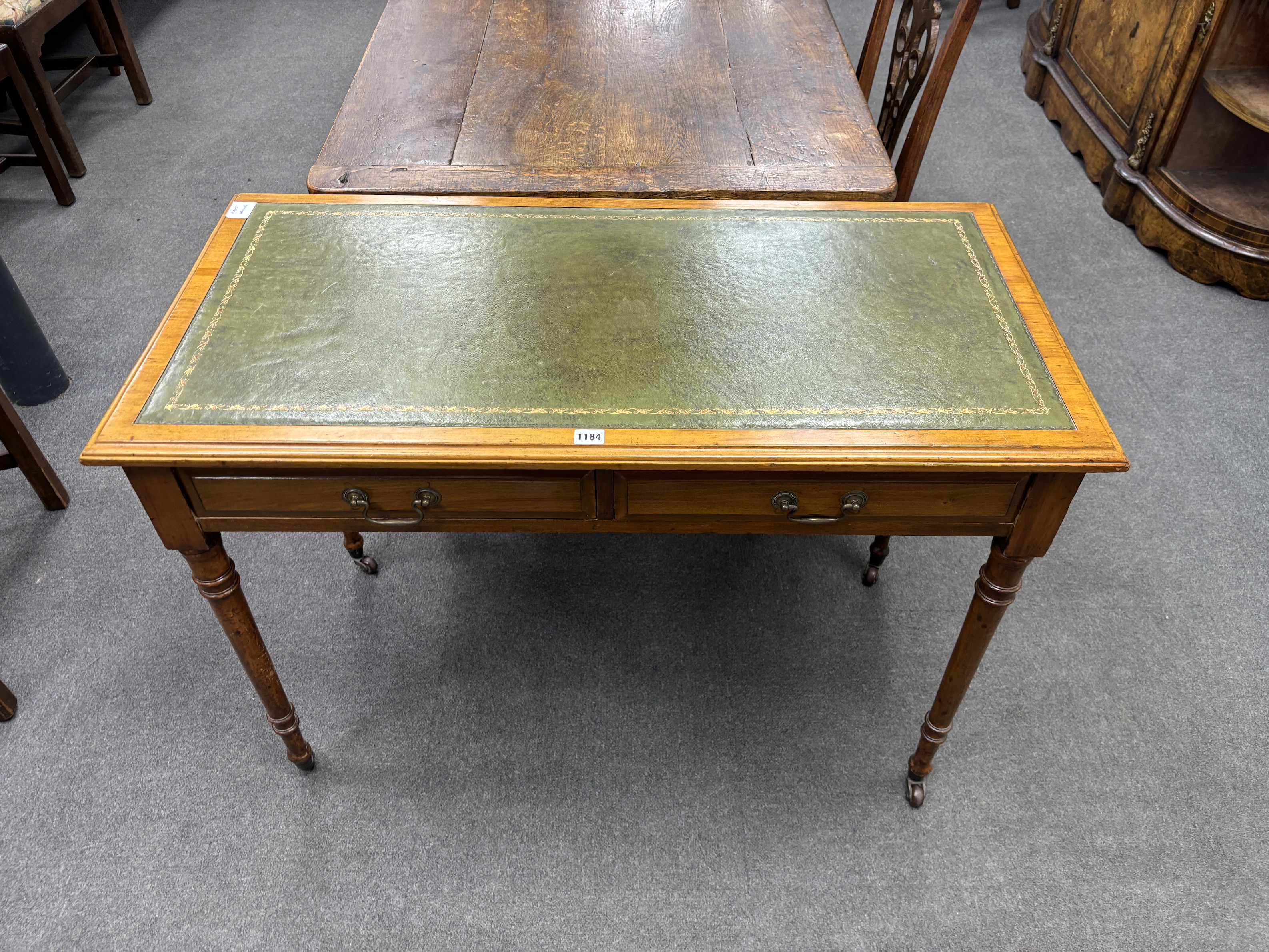 A Victorian satin walnut two drawer writing table, width 106cm, depth 53cm, height 75cm